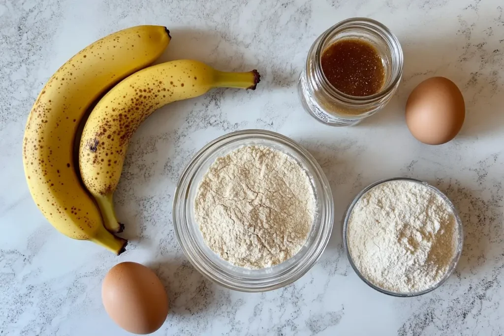 Ingredients for sourdough discard banana muffins laid out on a countertop.